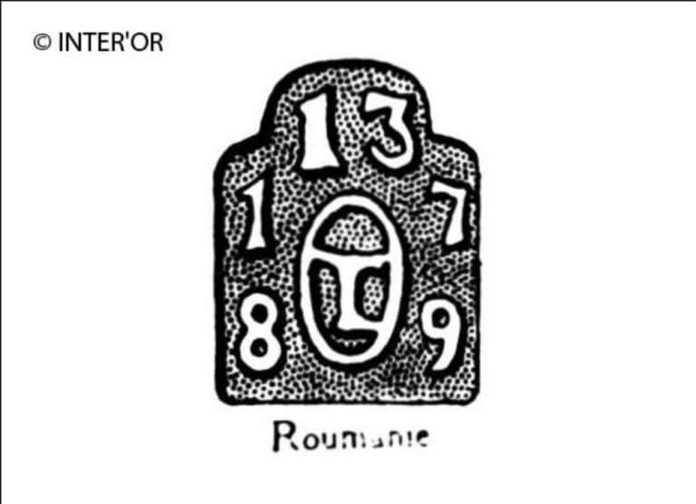 T dans un cercle surmonte du nombre 13